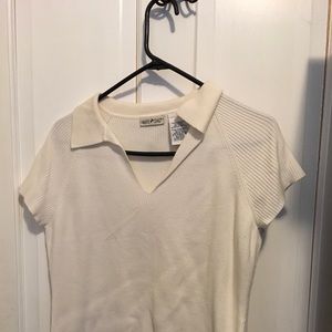 Ivory, cap-sleeved sweater blouse.